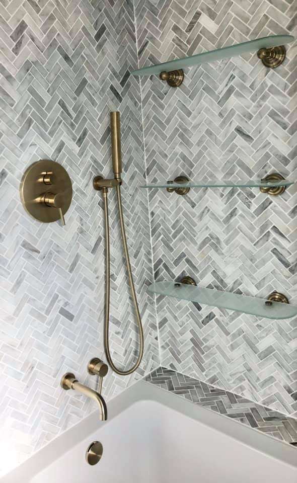 Brass shower on herringbone marble, by Plumber4life