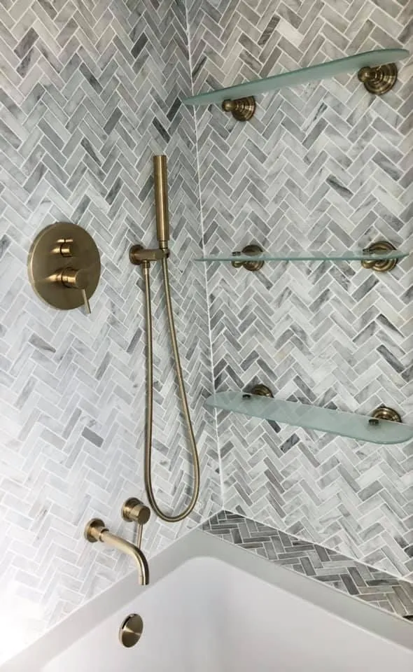 Brass shower on herringbone marble, by Plumber4life