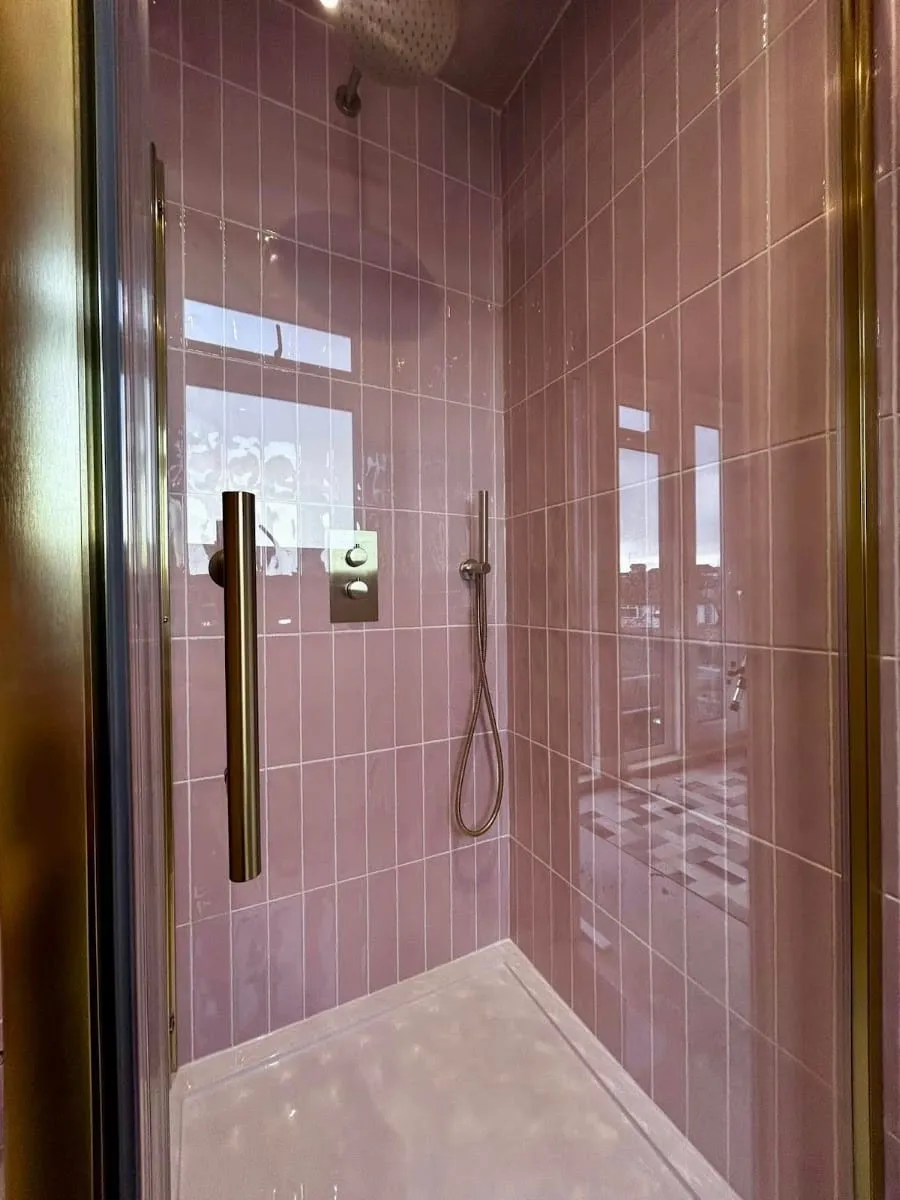 Pink tiled shower with brass, by Plumber4life